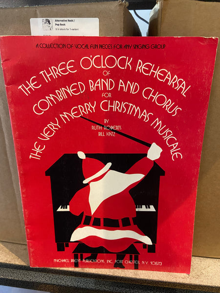 Ruth Roberts and Bill Katz – The Three O'Clock Rehearsal Of Combined Band And Chorus For The Very Merry Christmas Musicale - Used Paperback Book 1977 Michael Brent Publications - Shuga Records