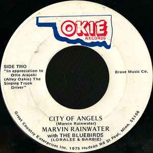 Marvin Rainwater With The Bluebirds (Loralee & Barbie) – Henryetta / City Of Angels - New 7" Single Record 1981 Okie USA Vinyl - Country - Shuga Records