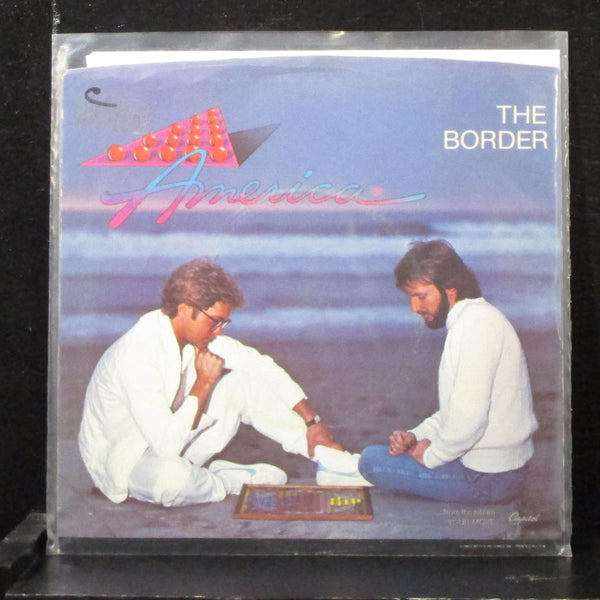 America - The Border / Sometimes Lovers 7" Mint- Vinyl 45 Capitol B-5236 USA - Shuga Records