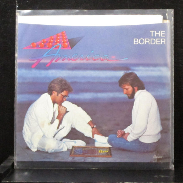 America - The Border / Sometimes Lovers 7" Mint- Vinyl 45 Capitol B-5236 USA - Shuga Records