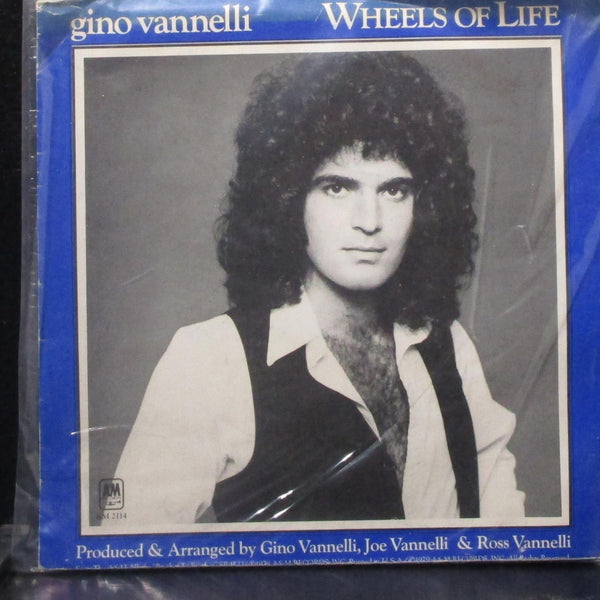 Gino Vannelli - Wheels Of Life / Mardi Gras 7" VG+ poster sleeve AM 2114 USA - Shuga Records