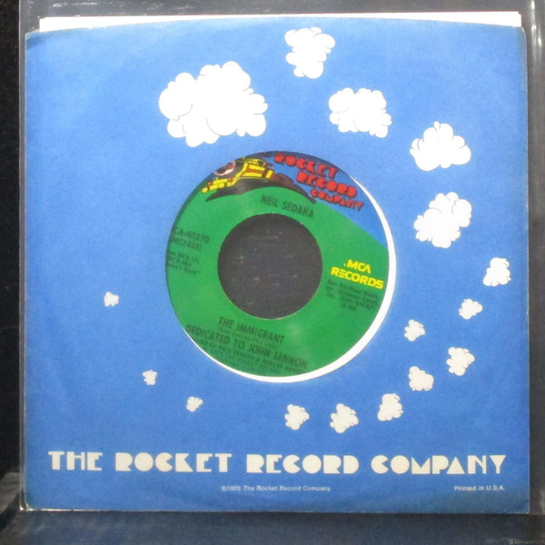 Neil Sedaka - The Immigrant / Hey Mister Sunshine 7" Mint- 45 Rocket MCA-40370 - Shuga Records