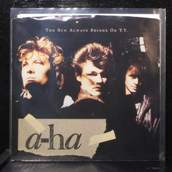 a-ha - The Sun Always Shines On T.V. / Driftwood 7" Mint- Warner Bros. 7-28846 - Shuga Records