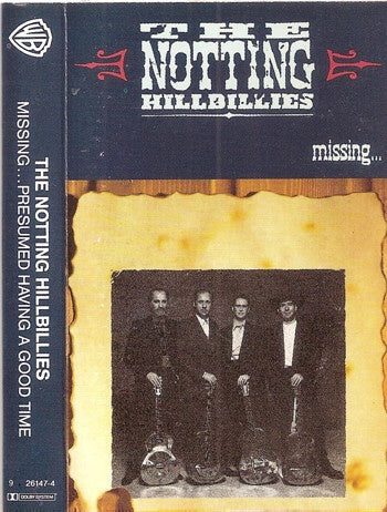 The Notting Hillbillies – Missing... Presumed Having A Good Time - Used Cassette 1990 Warner Bros. Tape - Folk / Rock